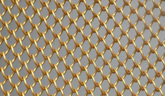 Brass chain link fence shows golden appearance