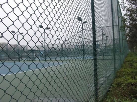 Green chain link fence around a tennis court